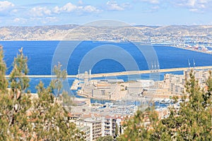 A scenics aerial view of the old port (vieux port) of Marseille, bouches-du-rhone, France under a majestic blue sky