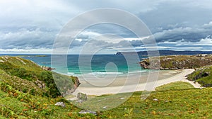 A scenics beautiful view of the Ceannabeinne Beach along the A838 touristic road near Durness in the Scottish Highland under a  a