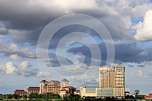 Scenics of the city along the Mekong river against cloudy sky.