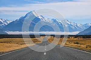 Sceninc road along Lake Pukaki goes all the way under the Southern Alps of New Zealand with the highest mountain Mt Cook, Aoraki