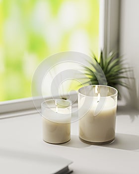 Scented candle, burning white aromatic candles in glass on white surface with green plant on background, home aromatique candles,