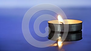 Scented Candle light over blue background