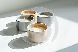 Scented Candles Illuminated by Sunlight on a Clean Surface