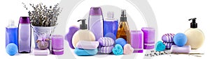 Scented candles, soaps, shampoos and other cosmetics with lavender extract isolated on white. Collage. Wide photo