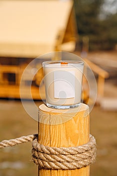 Scented candles on a wooden pole