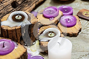 Dull candles with ornate wood and scented and energetic incense photo