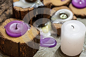 Dull candles with ornate wood and scented and energetic incense photo