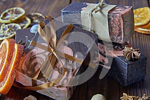 Scented organic dark handmade soap, scented spices and orange slices