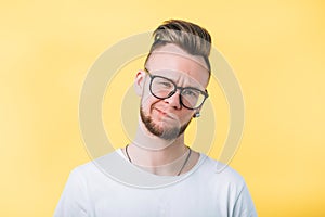 Sceptic doubtful emotional hipster guy portrait