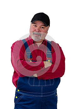 Sceptical farm worker standing staring at camera