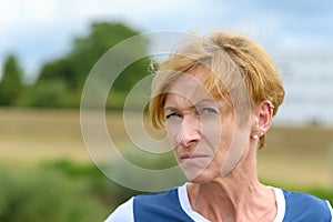 Sceptical woman looking sideways at the camera