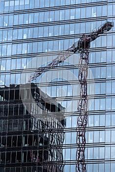 Schaerbeek, Brussels Capital Region - Belgium - Reflections of office buildings in plate glass at the administrative district