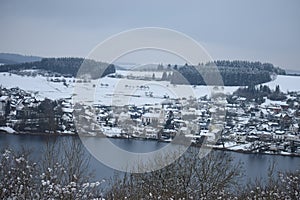 Schalkenmehren at the Maar in snowy winter landscape