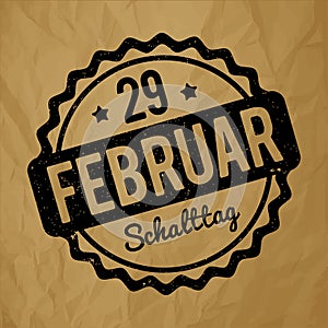 Schalttag 29 Februar Stempel German black on a crumpled paper brown background.