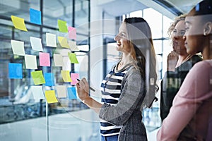 Schedule, glass and business people writing in office for planning, collaboration and goal objectives. Teamwork