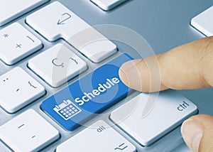Schedule - Inscription on Blue Keyboard Key photo