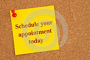 Schedule your appointment today on a yellow sticky note on corkboard