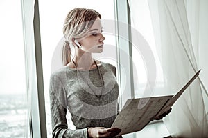 Successful woman holding papers with schedules for employees