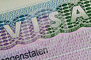 Schengen European visa stamp in the passport. Clouse-Up.