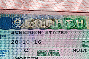 Schengen visa in the passport closeup selective focus