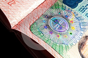 Schengen visa in the passport closeup selective focus