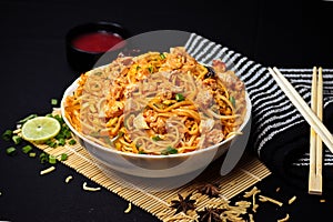 Schezwan or Szechuan Chicken Noodles - Chinese or indo-chinese food photo