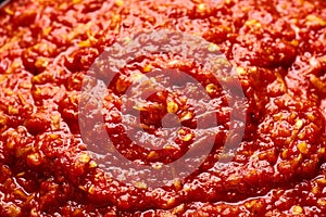 Schezwan Sauce close up texture. Schezwan Sauce is Indo-chinese or Sichuan cuisine hot sauce with red chilli, garlic and ginger