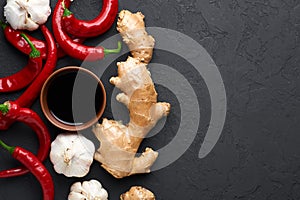 Schezwan Sauce ingredients at dark slate background with copy space. Schezwan Sauce is Indo-chinese or Sichuan cuisine hot sauce