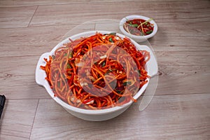 Schezwan Veg Noodles is a popular Indo-Chinese dish that is prepared with noodles, vegetables and show sauce and is served on a