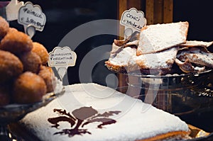 Schiacciata fiorentina and cenci, traidional cake and crisp from photo
