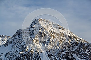 Schiesshorn mountain near Arosa in winter with cloudy blue sky