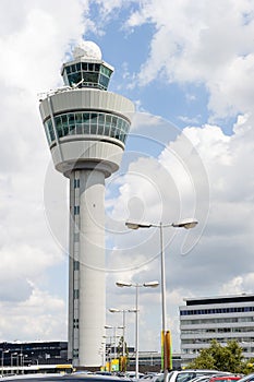 Schiphol airport command tower against cloudy sky