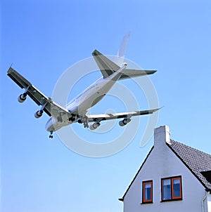 Schiphol runway approach by plane low over houses