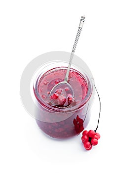 Schisandra jam in glass jar isolated on white