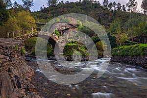 Schist houses and double bridge in historic shale village in Foz D Egua photo