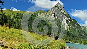 Schlierersee, Lungau.Mountain peak and green transparent water of mountain lake