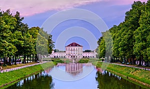 Schloss Nymphenburg, a Baroque palace in Munich, Germany at sunset