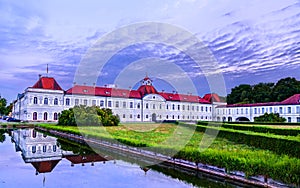 Schloss Nymphenburg, a Baroque palace in Munich, Germany at sunset