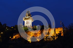 The Schlossberg or Castle Hill with the tower Uhrturm at night,