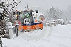 Snow removal winter service with a truck in the Salzkammergut