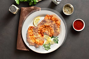 Schnitzel with lemon and leaves of parsley
