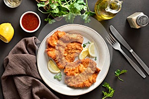 Schnitzel with lemon and leaves of parsley