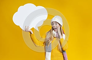 Schocked girl holding communication bubble in her hand