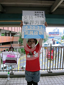 Scholarism Democracy Protester Holds Occupy Central Sign