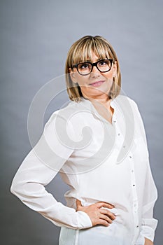 Scholarly attractive woman in glasses photo