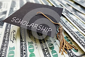 Scholarship cap on money photo