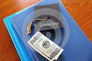 Scholarship graduate and books