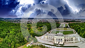 Schonbrunn Palace aerial panoramic view during a storm in Vienna, Austria. Schloss Schoenbrunn is an imperial summer residence