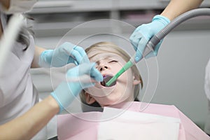 School age boy lying in the dental chair