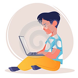 School-age or preschool-age child using laptop computer. Distance learning.